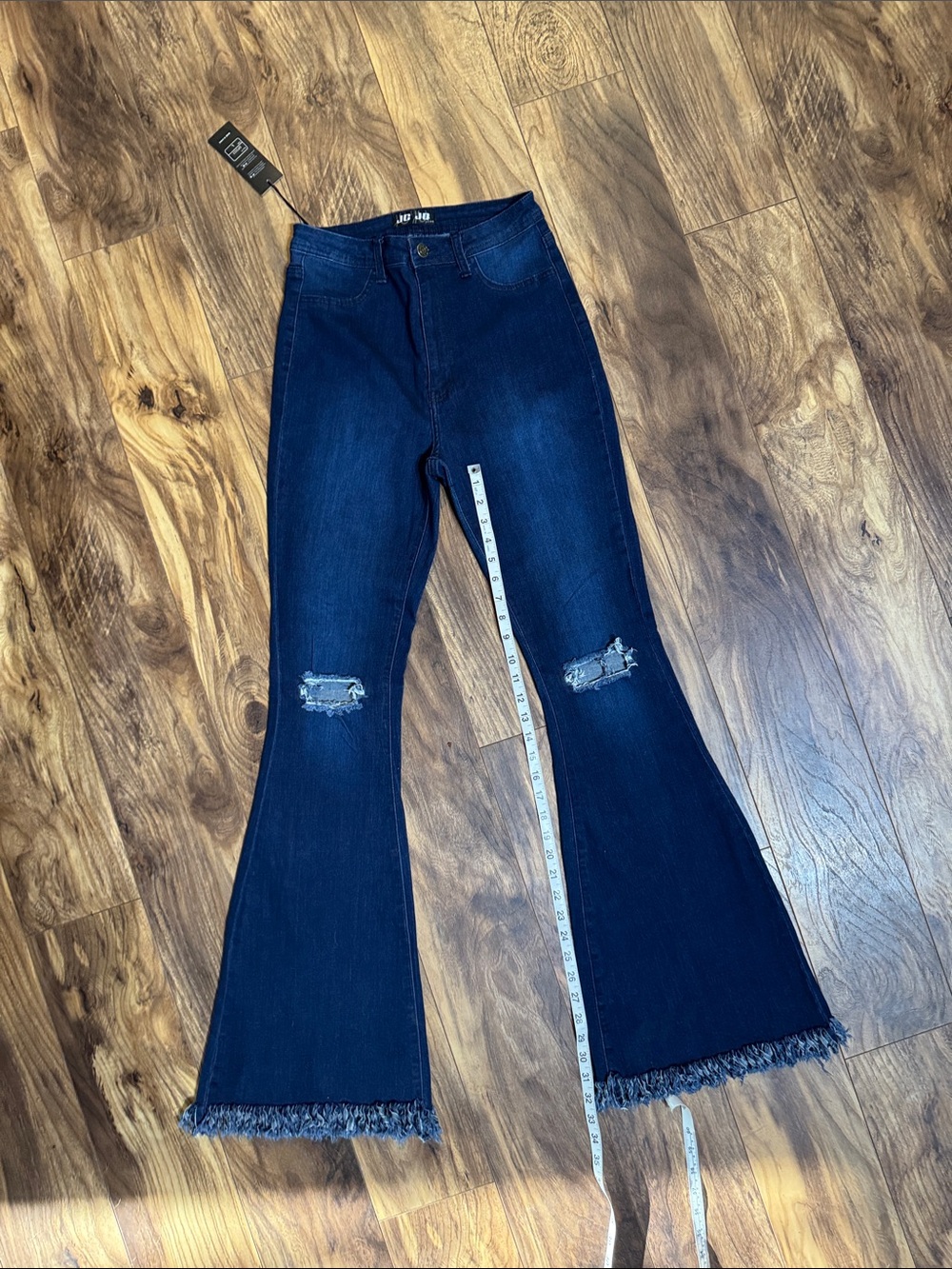 High-Rise Dark Blue Flare Jeans with Distressed Knees